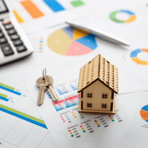 Kingfisher House Buyers logo on financial documents and house model.