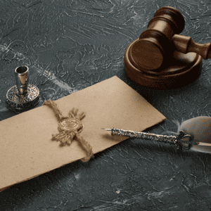 Gavel, legal documents, and pen on dark surface for probate case.