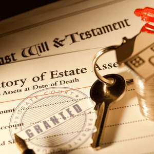 Real estate and estate planning documents with a house key for probate process.