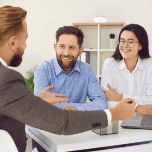 Real estate professionals discussing property options with clients.