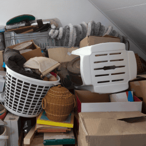 Cluttered room with discarded household items and furniture.