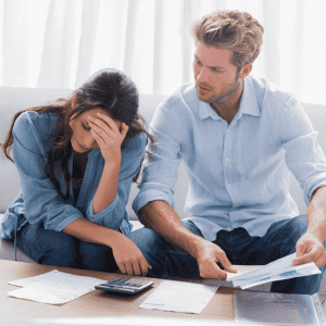 Siblings discussing inheritance and property division at home.