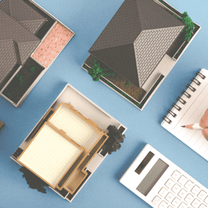 Three house models with different layouts and a notepad on a blue background.