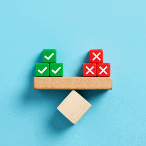 Balance scale with checkmarks and crosses representing options for selling a house as-is.